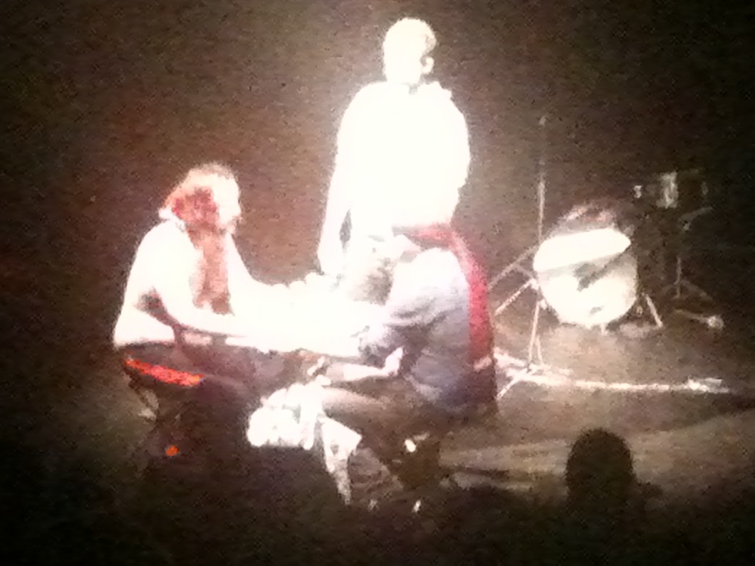 Nick Helm reenacts the Deer Hunter with a lazy Susan loaded with several cans of Fanta and one can of Tango.